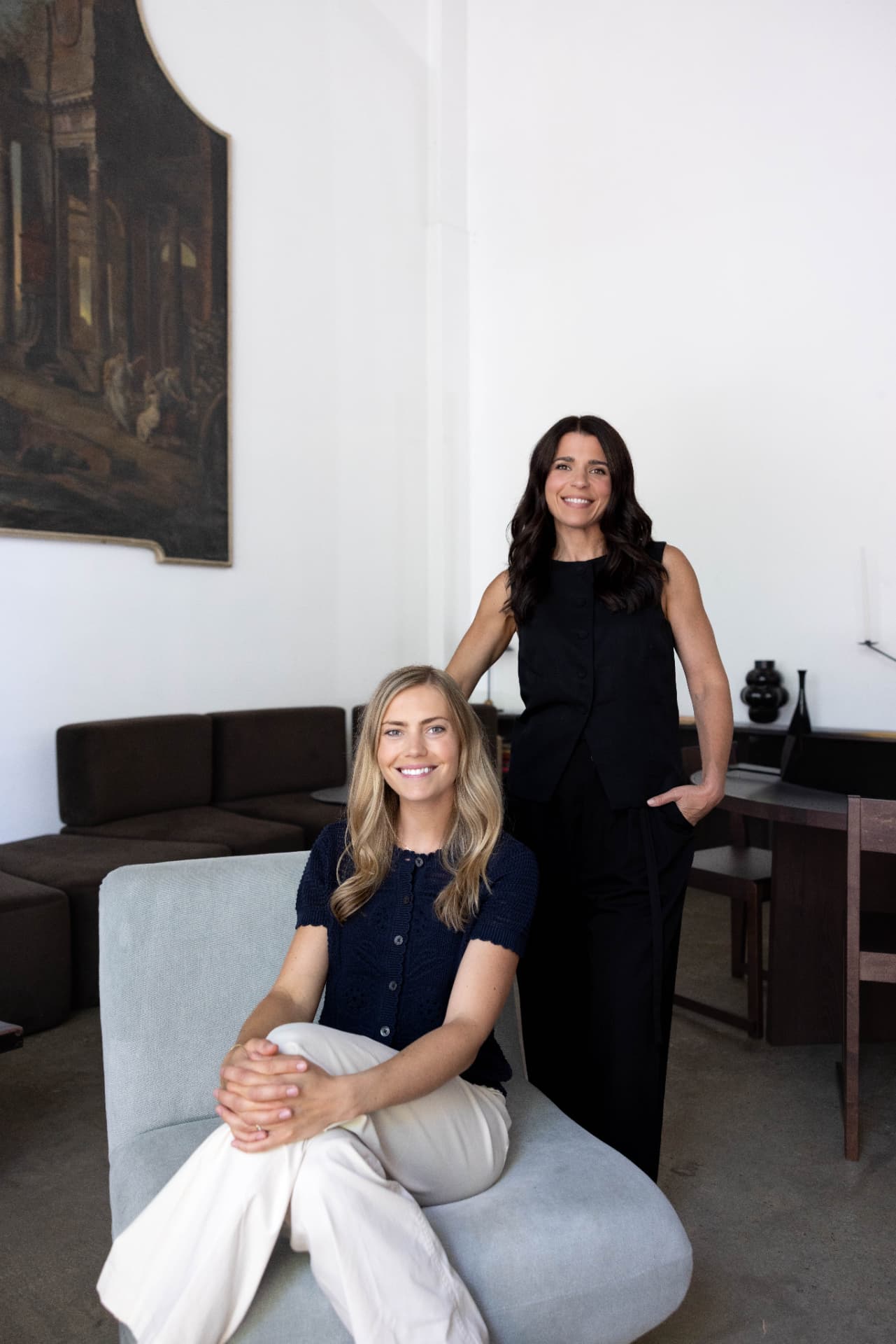 The two hosts of Caring Through It together in a bright studio